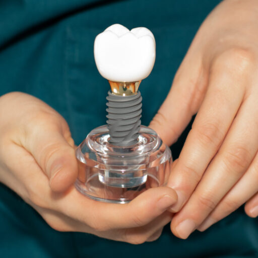 implant dentist adelaide holding a dental implant model